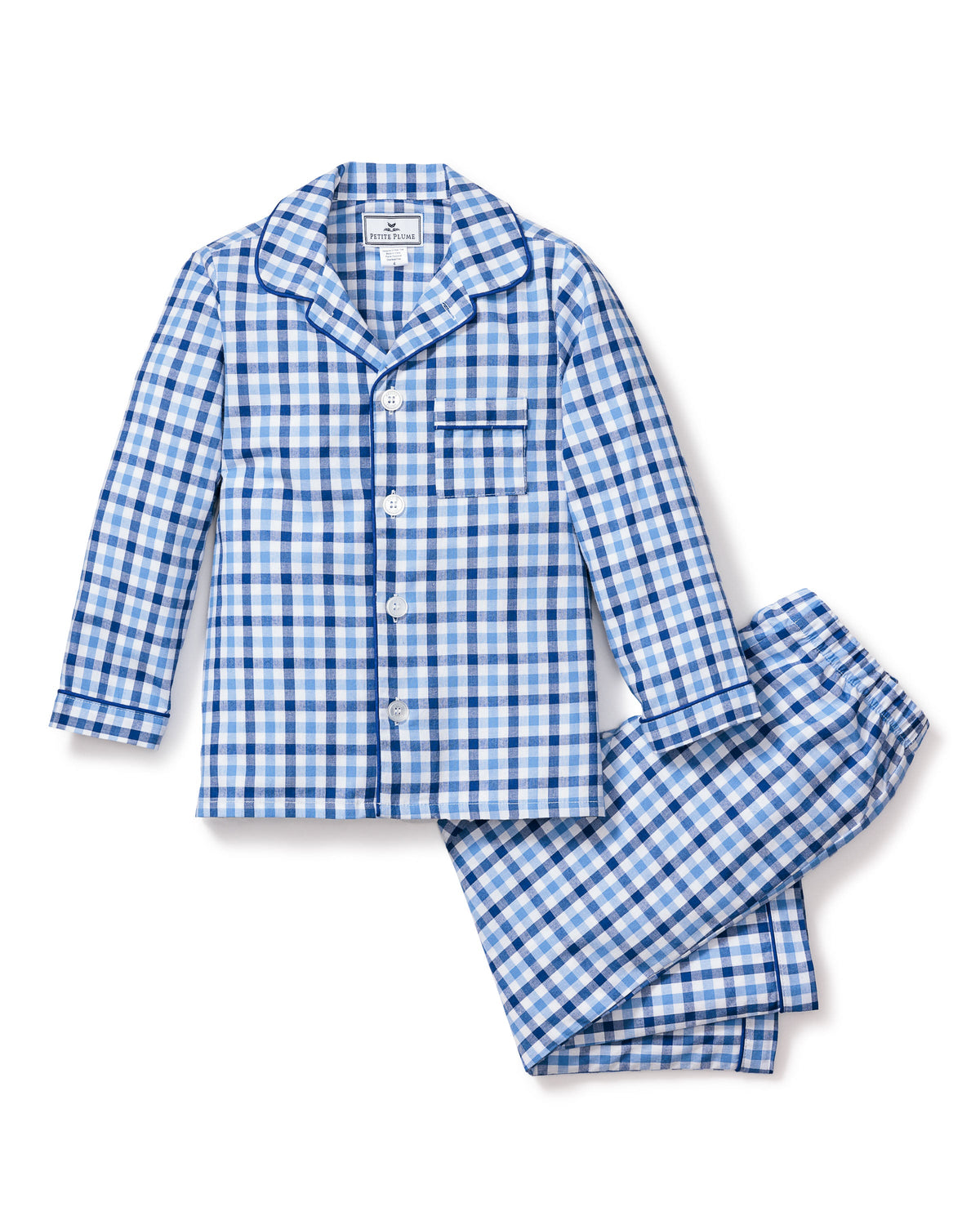 The Kids Twill Pajama Set by Petite Plume in Royal Blue Gingham features a long-sleeve button-up top with a chest pocket and matching pants. Its classic gingham print and pointed collar offer style and comfort for a restful nights sleep.