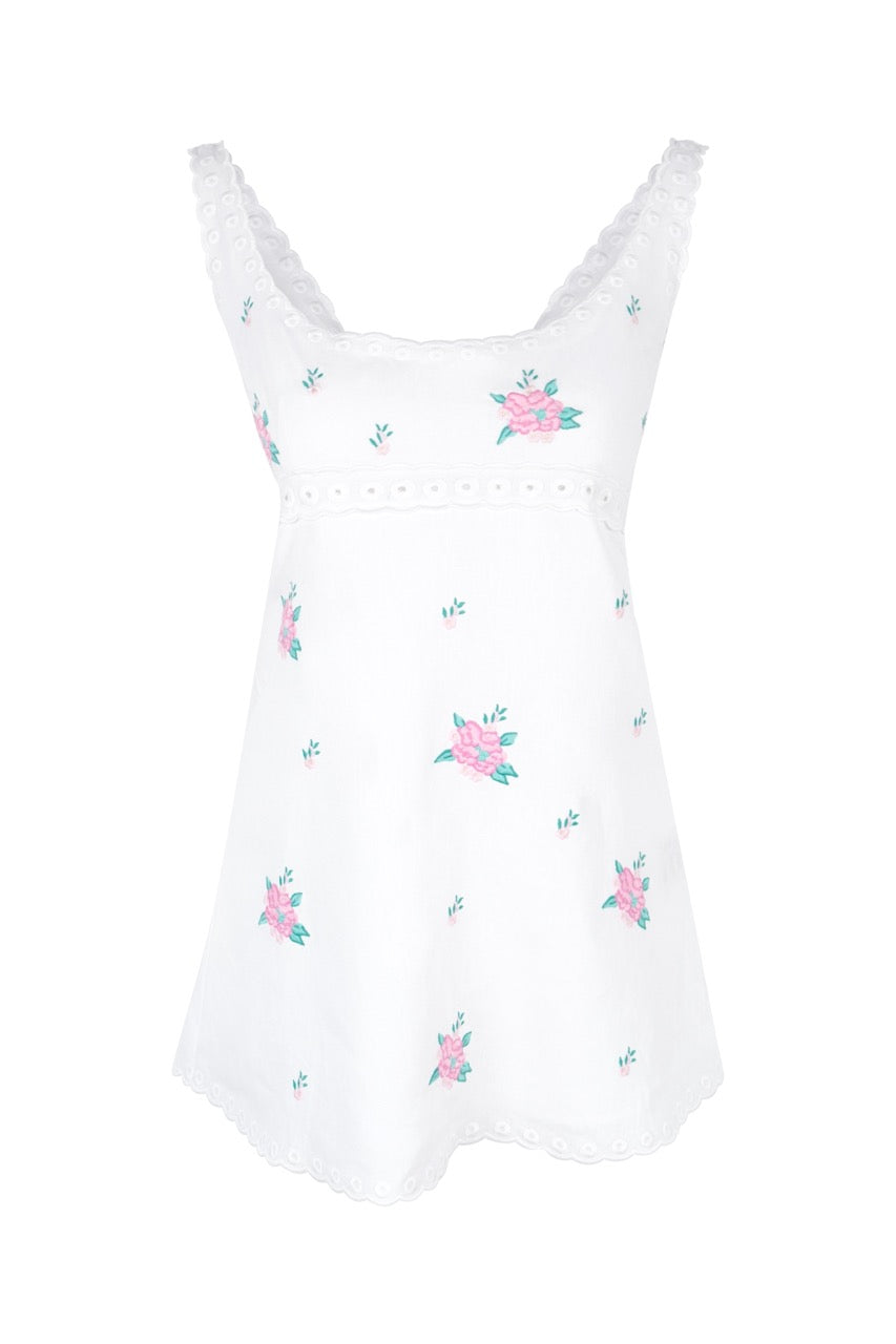 Front view of OTM Exclusive: Alivia Dress showcasing white sleeveless mini silhouette with floral and scallop embroidery