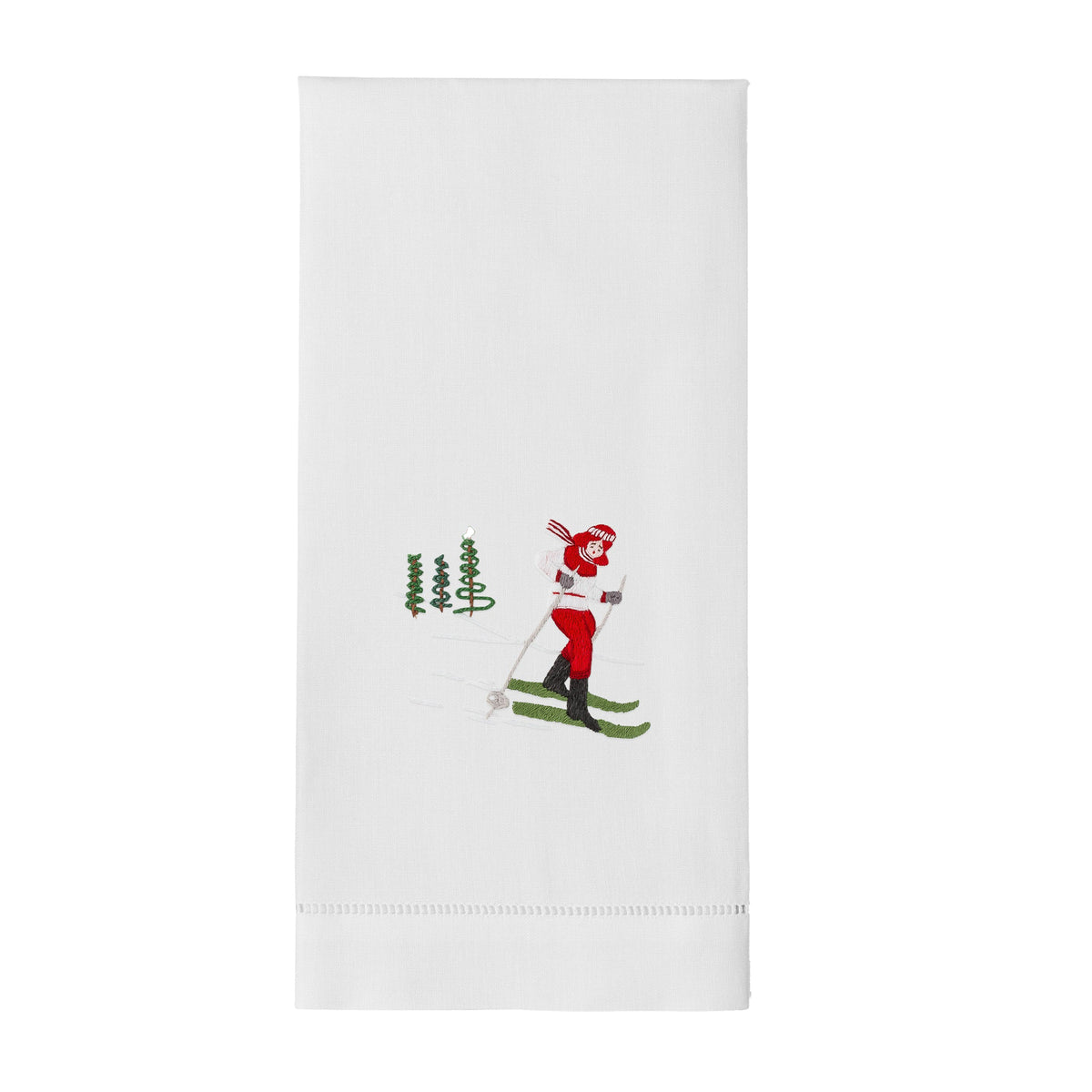 Flat front view of Skier Jill towel showcasing hand-embroidered skier motif and hemstitching on white background