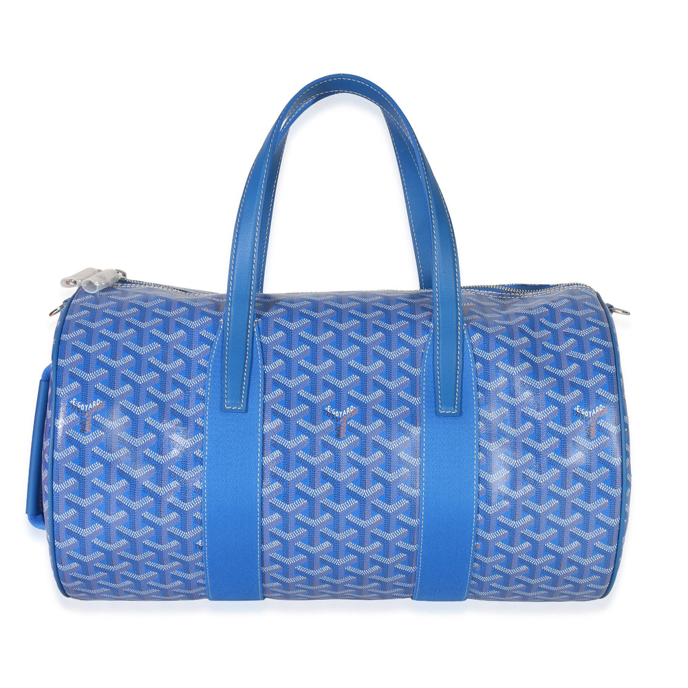 Front view of Goyardine Barrel 40 sports bag in sky blue showing chevron pattern, top handles and zip closure on white