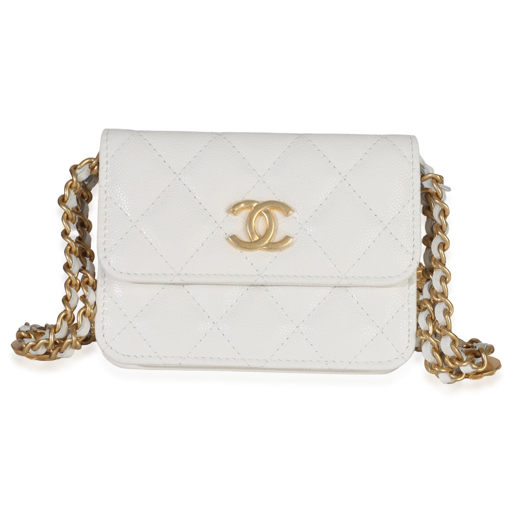 Front view of Chanel white quilted caviar coin purse showcasing gold CC logo and chain strap on white background