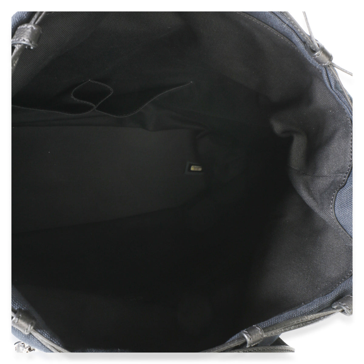 Top view of Chanel Navy Blue Raffia CC Expandable Shopping Tote showcasing its black fabric interior on a white background