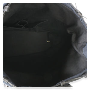 Top view of Chanel Navy Blue Raffia CC Expandable Shopping Tote showcasing its black fabric interior on a white background
