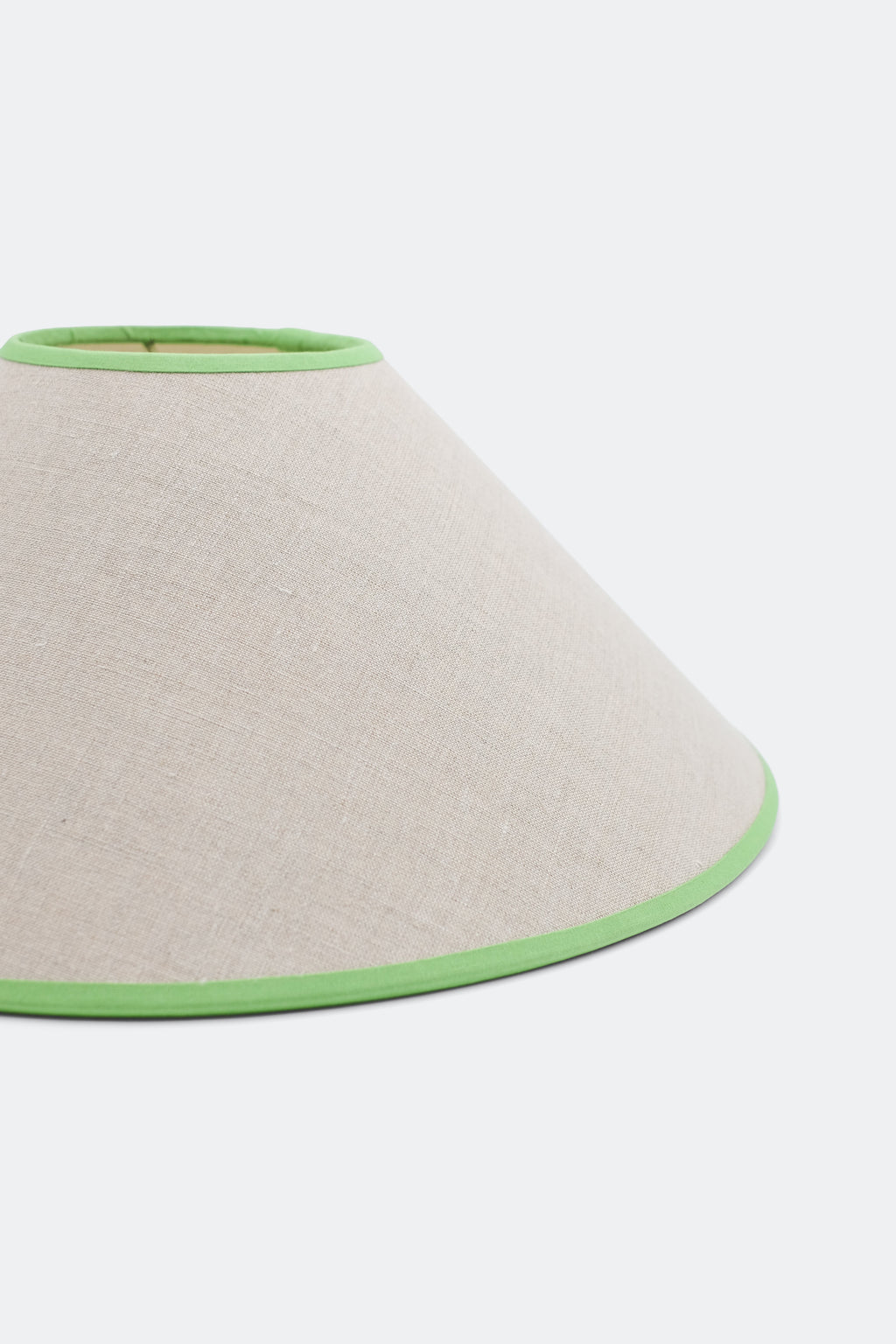 Close-up of 16'' tapered cone lampshade with green trim - linen material