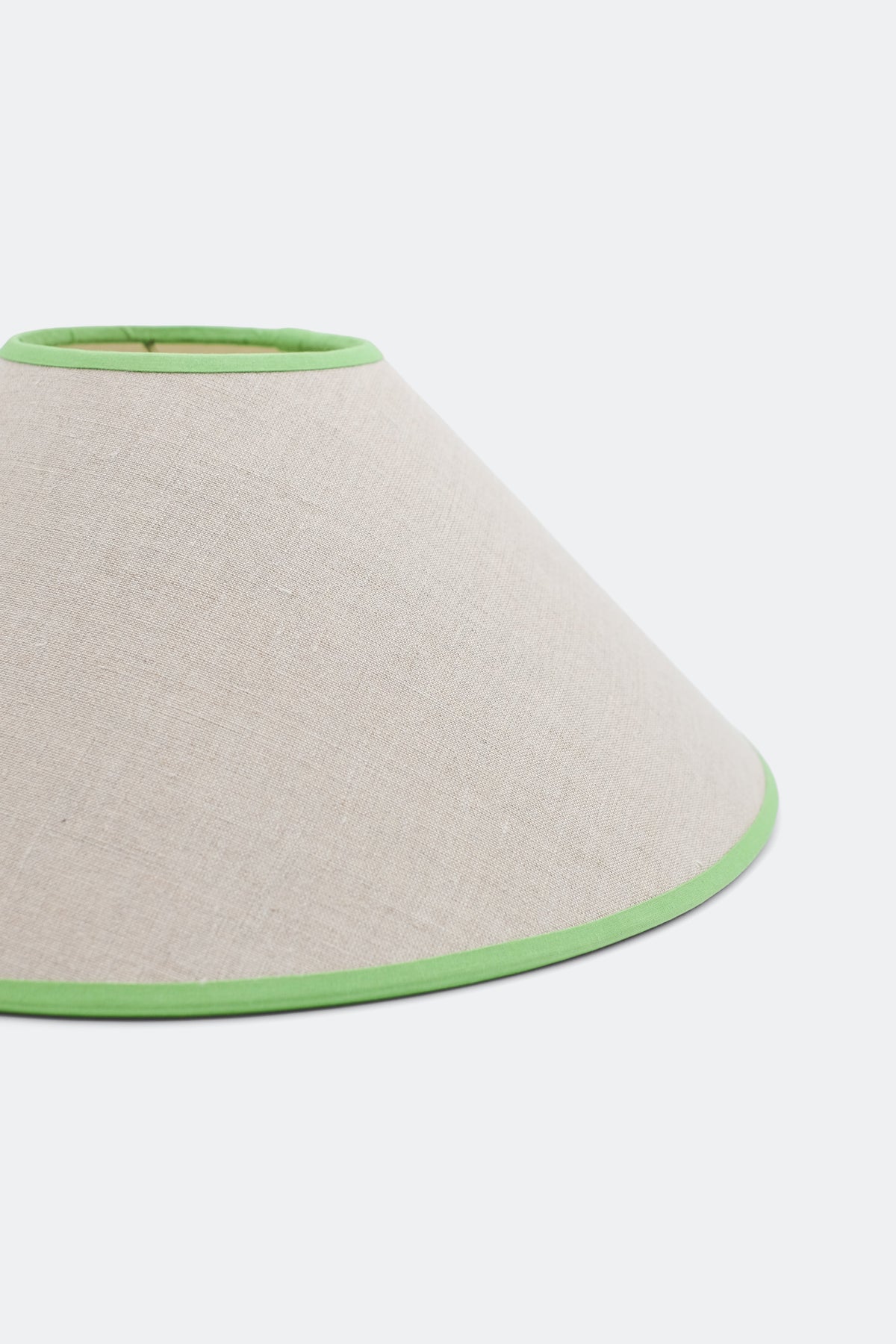 Close-up of 16'' tapered cone lampshade with green trim - linen material