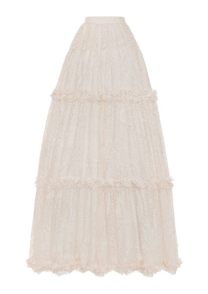 Front view of The Agatha Skirt showcasing ivory lace overlay and tiered appliquéd ruffles on white background