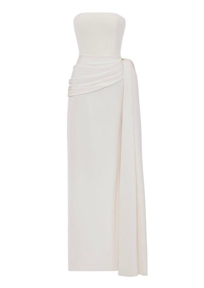 Front view of The Greta Gown showcasing a strapless draped bodice, side bow, and sash against a white background