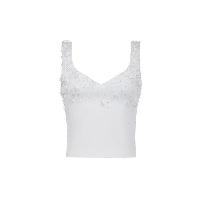 Front view of The Kay Top showcasing hand-embellished pearls and fabric flowers on a white background