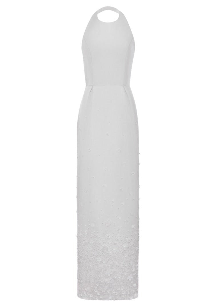 Front view of The Olympia Gown showcasing halter neckline, box pleats, pearls, and floral motifs on a white background