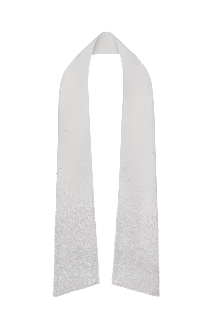 Front view of The Bianca Shawl showcasing hand-embroidered pearls and fabric flowers on a white background