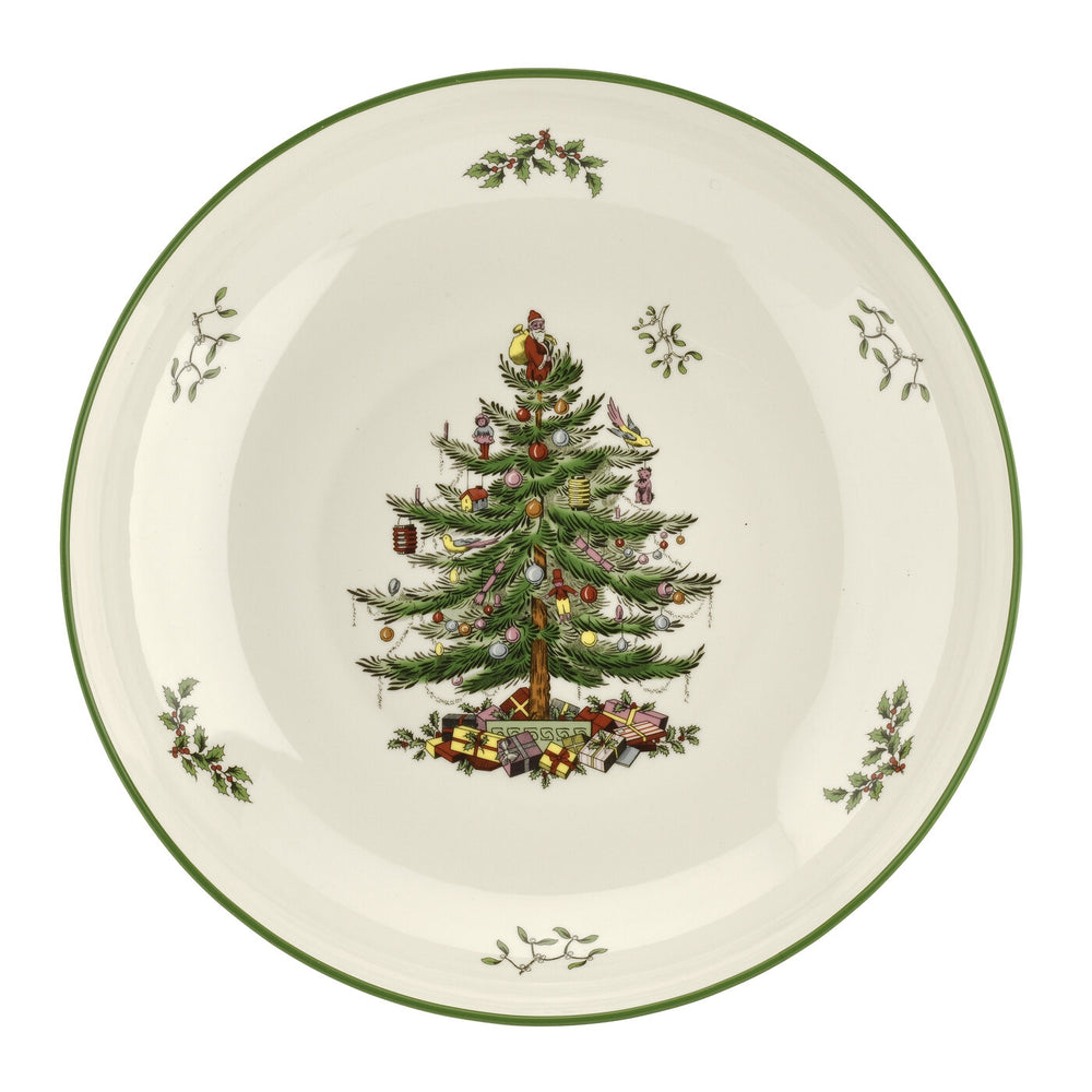 Top view of 13-inch Christmas Tree pasta bowl showing central decorated tree motif, holly sprigs, and green rim on white