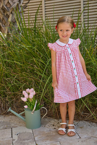 Little English traditional children's clothing. Classic dress for toddler girls in red windowpane with peter pan collar and tulip embroidery