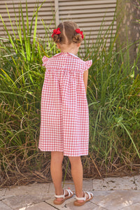Little English traditional children's clothing. Classic dress for toddler girls in red windowpane with peter pan collar and tulip embroidery