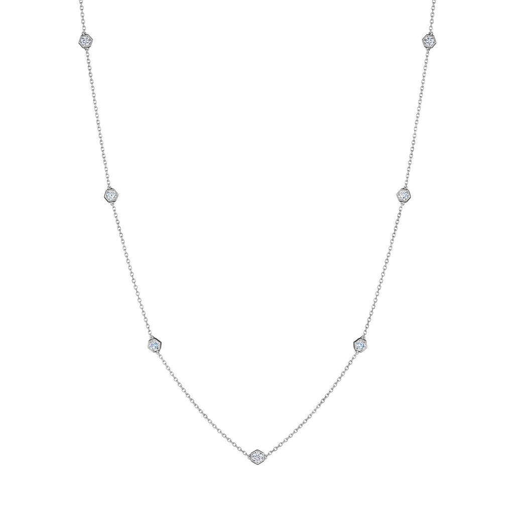 Small Serpentine Station Necklace in white gold, featuring hexagon bezel-set diamonds spaced along a fine chain, displayed on a white background.