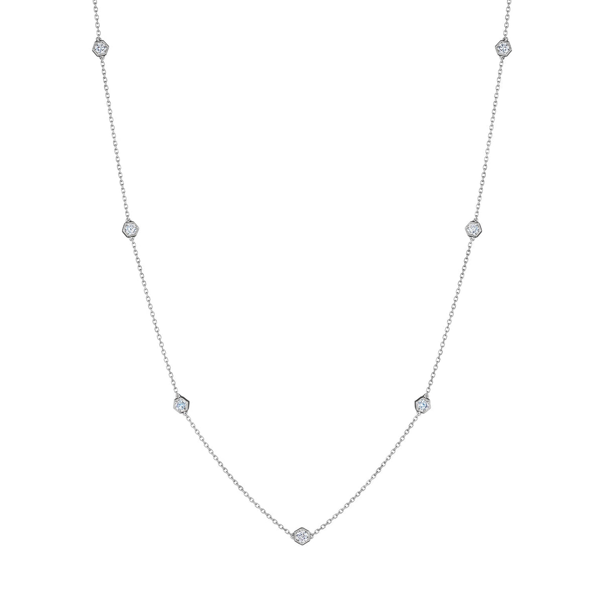 Small Serpentine Station Necklace in white gold, featuring hexagon bezel-set diamonds spaced along a fine chain, displayed on a white background.
