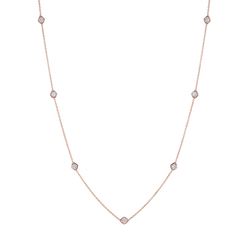 The Small Serpentine Station Necklace features hexagon bezel set diamonds spaced along a fine chain, shown on a plain white background.