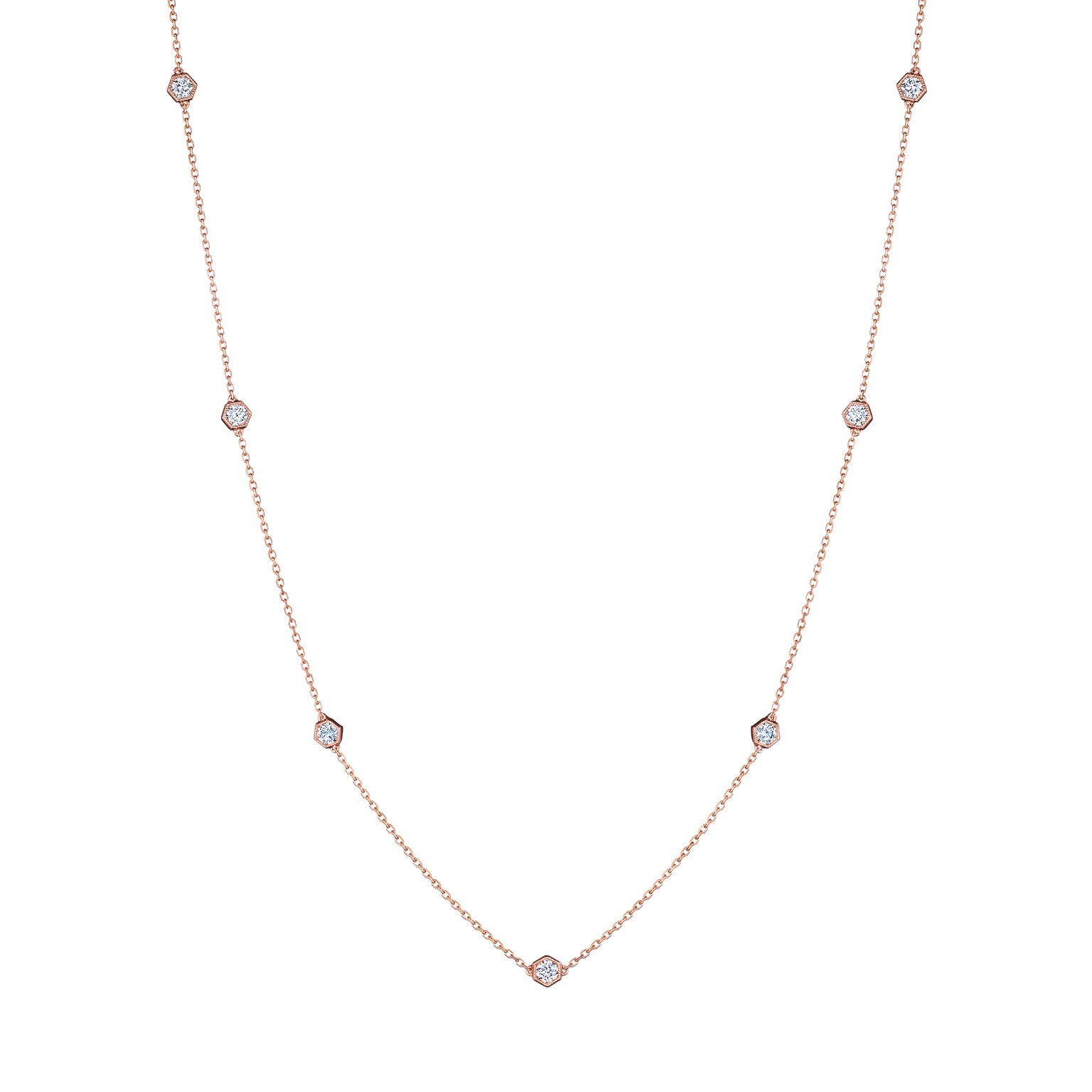 The Small Serpentine Station Necklace features hexagon bezel set diamonds spaced along a fine chain, shown on a plain white background.