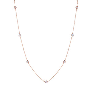 The Small Serpentine Station Necklace features hexagon bezel set diamonds spaced along a fine chain, shown on a plain white background.