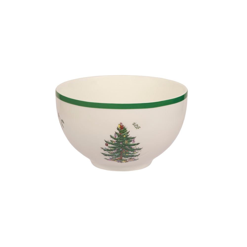 Angled front view of Spode 6-inch Christmas Tree porcelain rice bowl showing green rim and tree motif on white background