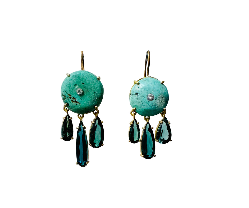 Front view of ancient turquoise, diamond and tourmaline earrings showcasing dangling tourmaline stones in 18 karat gold on white