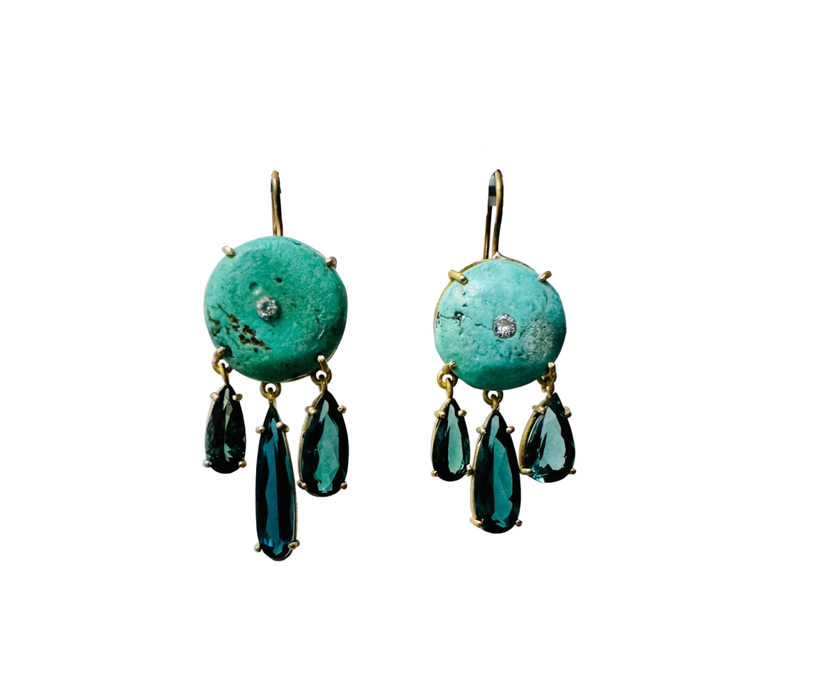Front view of ancient turquoise, diamond and tourmaline earrings showcasing dangling tourmaline stones in 18 karat gold on white