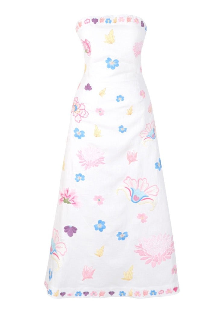 Front view of OTM Exclusive Maddie Dress showcasing strapless design and colorful floral embroidery on white background