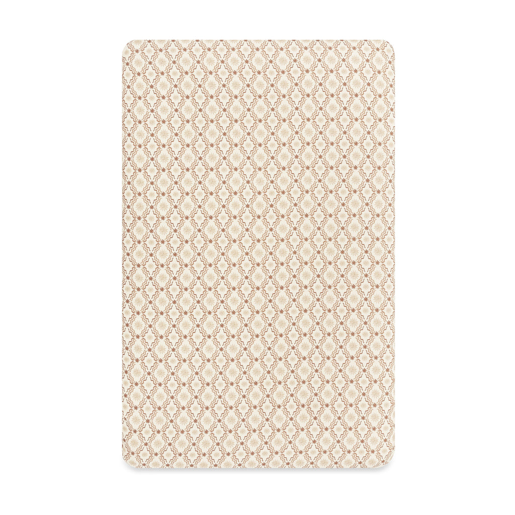 Front view of Mini Crib Sheet in Autumn Star showcasing a repeating beige geometric pattern on white background