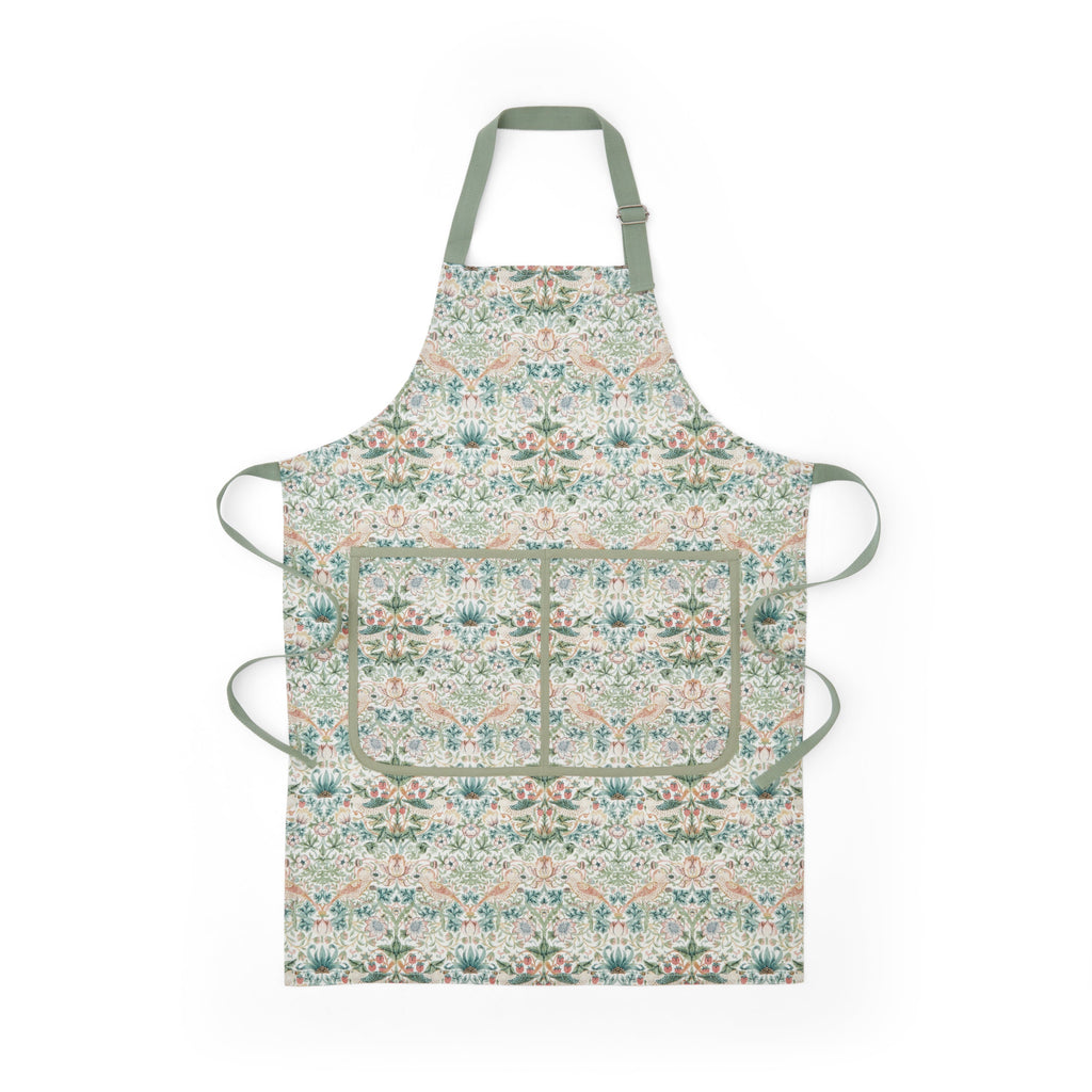 Front view of Morris & Co. apron showcasing its botanical pattern and divided front pocket with green ties on a white background