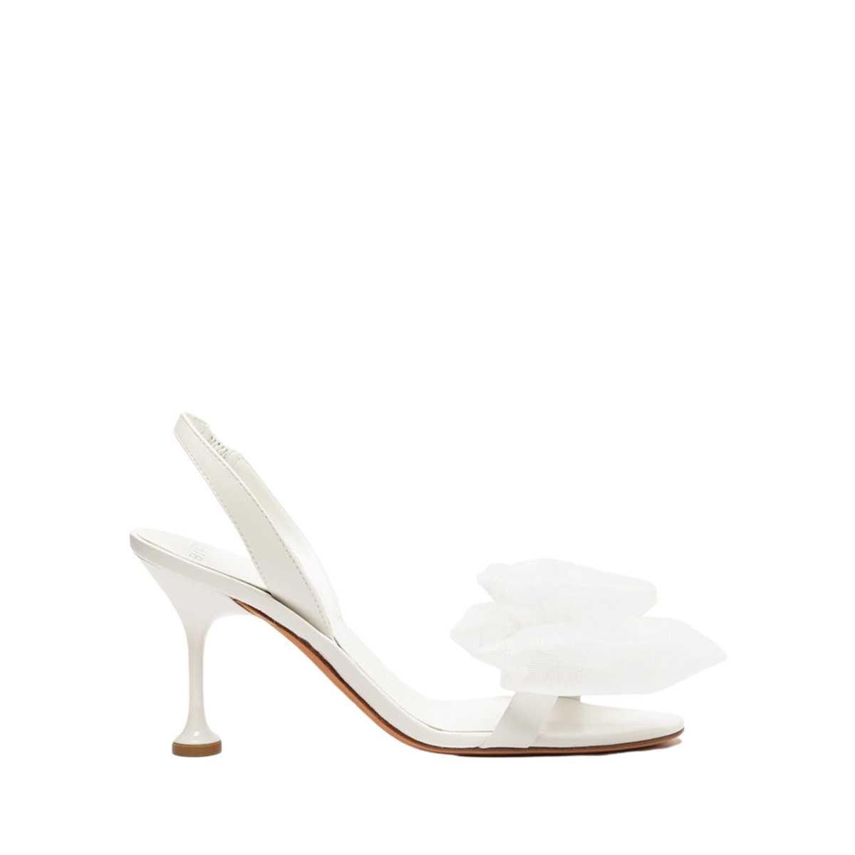 Side view of Isabelle 85 Bridal Sandal in White with oversized tulle rosette and flared stiletto heel on black background