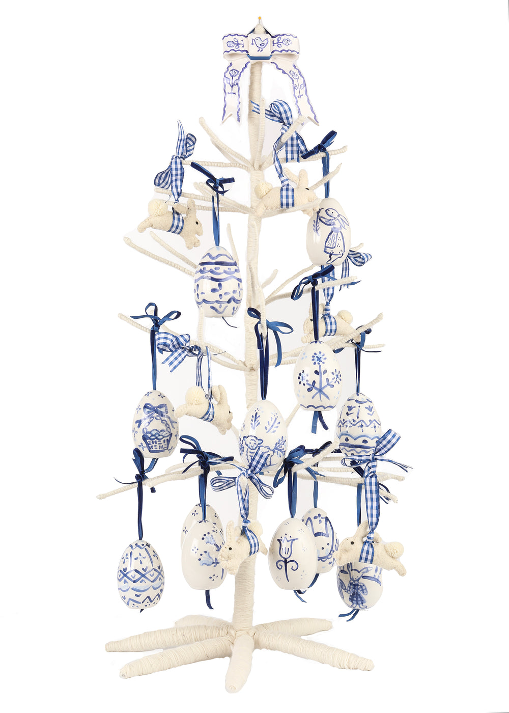 Front view of Large Celebration Tree showcasing blue and white hand-painted eggs, felt rabbit ornaments, and ceramic bow