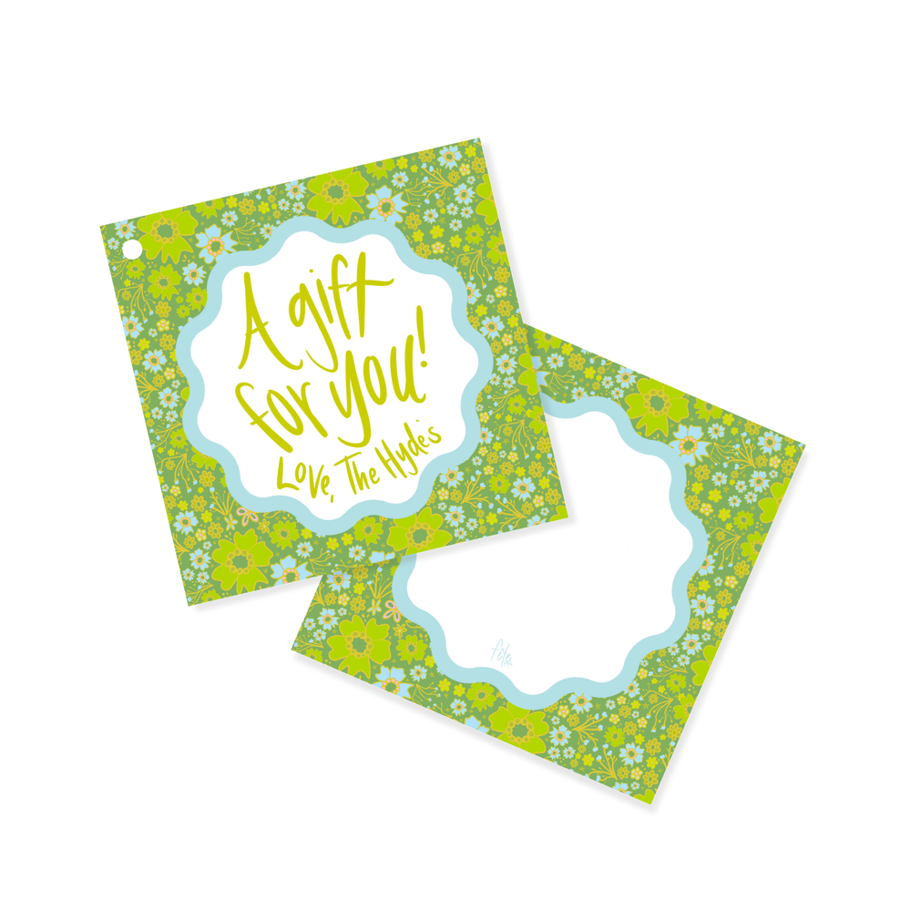 Angled view of Sky & Chartreuse ditsy floral square gift tags showing handwritten ‘A gift for you! Love, The Hydes’ on white