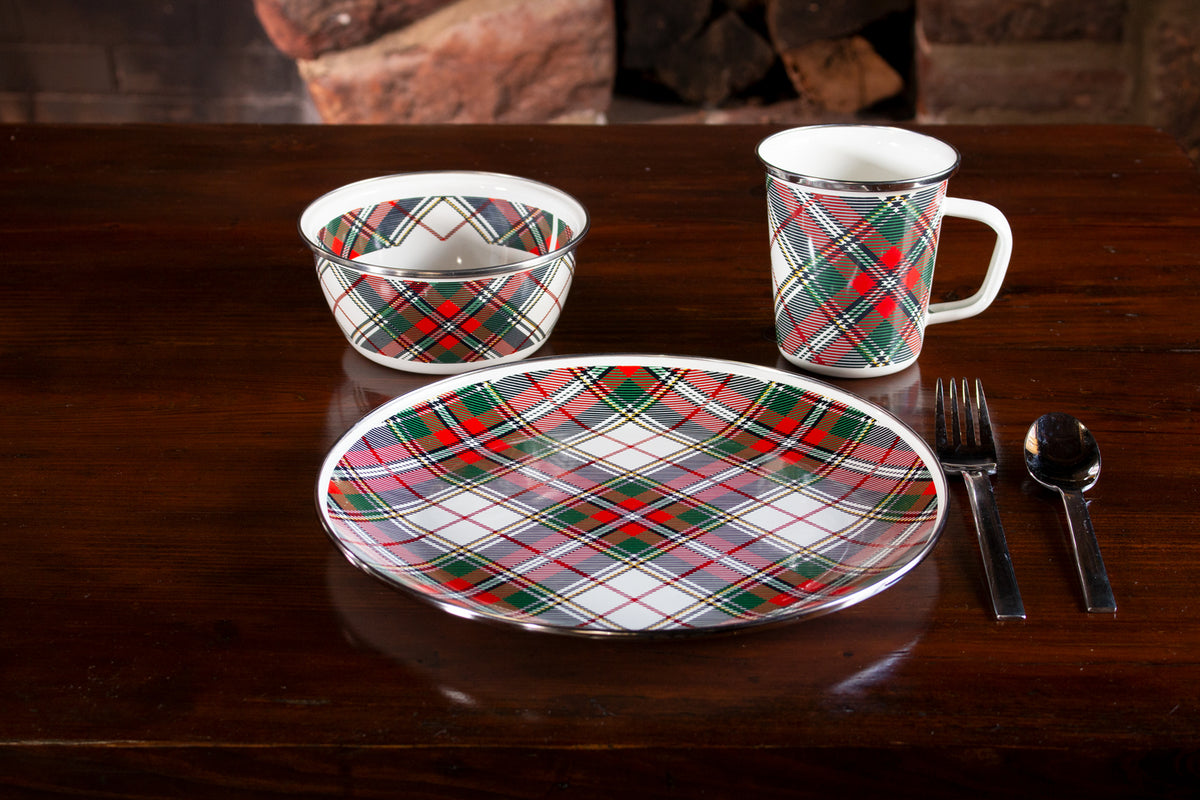 Front view of Dinner Plates in Highland Plaid, Set of 4 showcasing colorful plaid pattern and stainless steel trim on a dining table