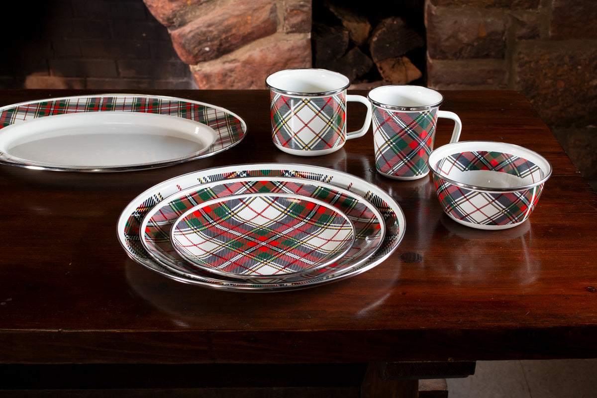 Front view of Grande Mugs in Highland Plaid, Set of 4 showcasing colorful plaid enamel mugs on a dark wood table