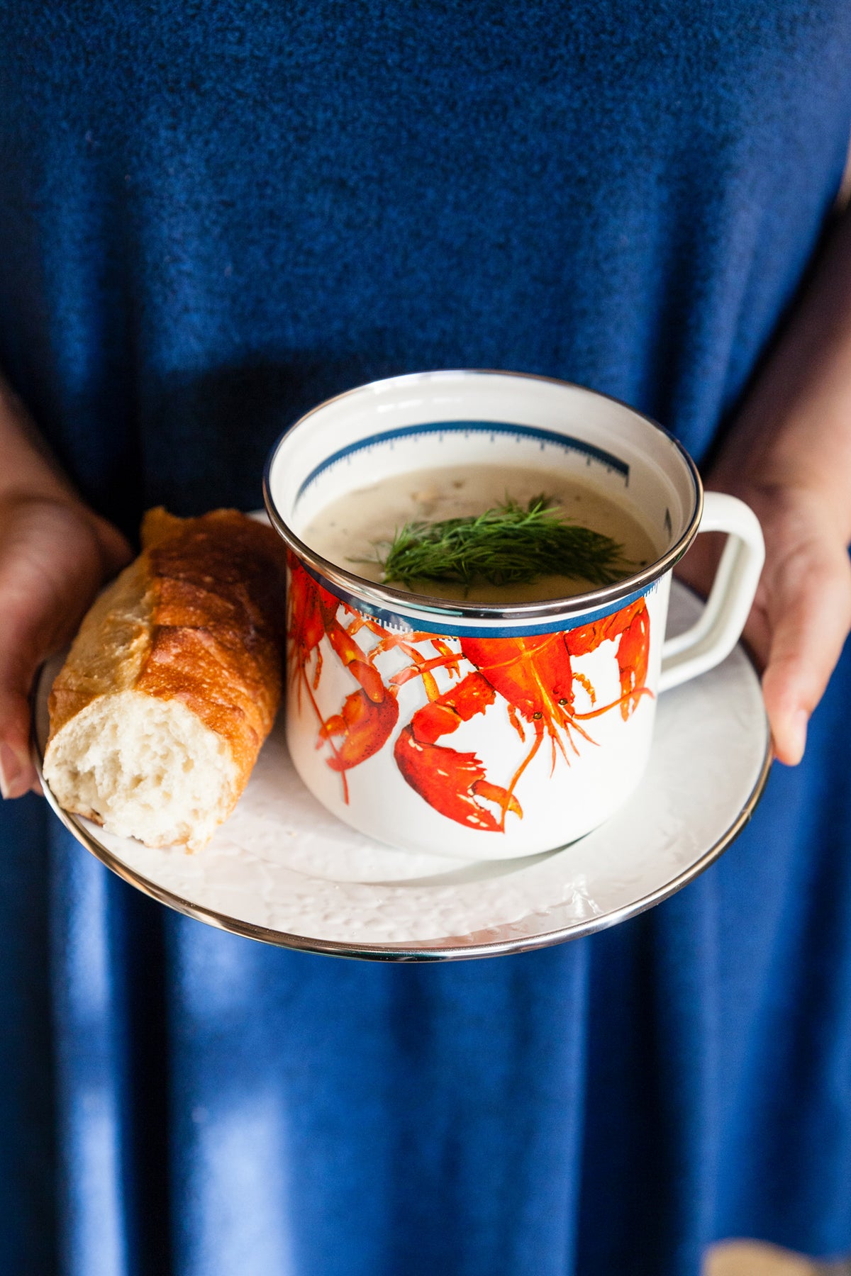 Close-up of Grande Mugs in Lobster, Set of 4 showcasing lobster design and stainless steel trim with soup and bread