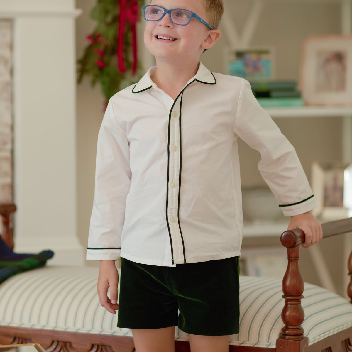 
Sullivan Shorts Set for boys in Grafton Green Velvet, featuring a white long-sleeve Peter Pan collar shirt with green piping and coordinating green velvet shorts.