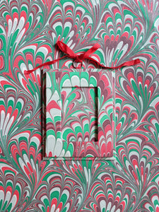 Holiday picture frame ornament in festive marble pattern on matching background