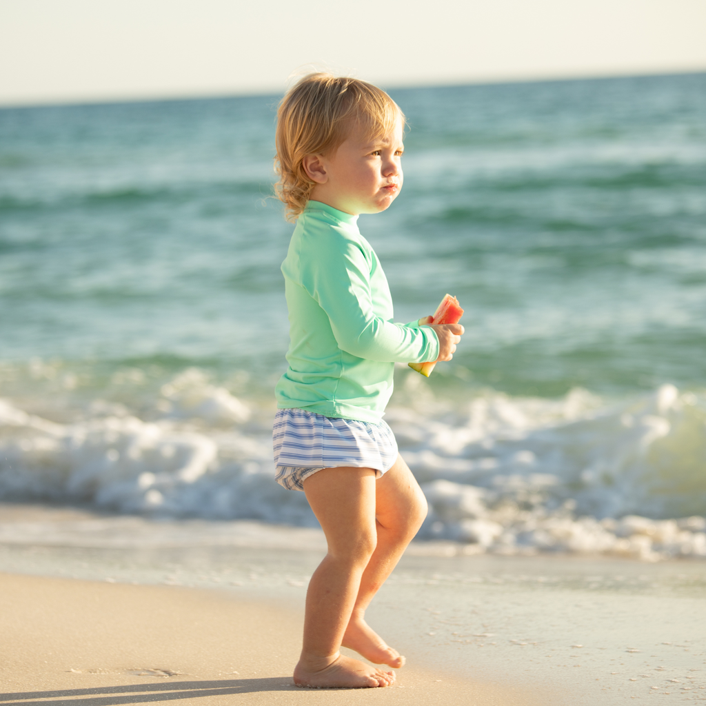 Baby boy swim bloomers in Seaside Seersucker with UPF 50+ protection; classic swim shorties with full coverage and elastic waist by Henry Duvall.