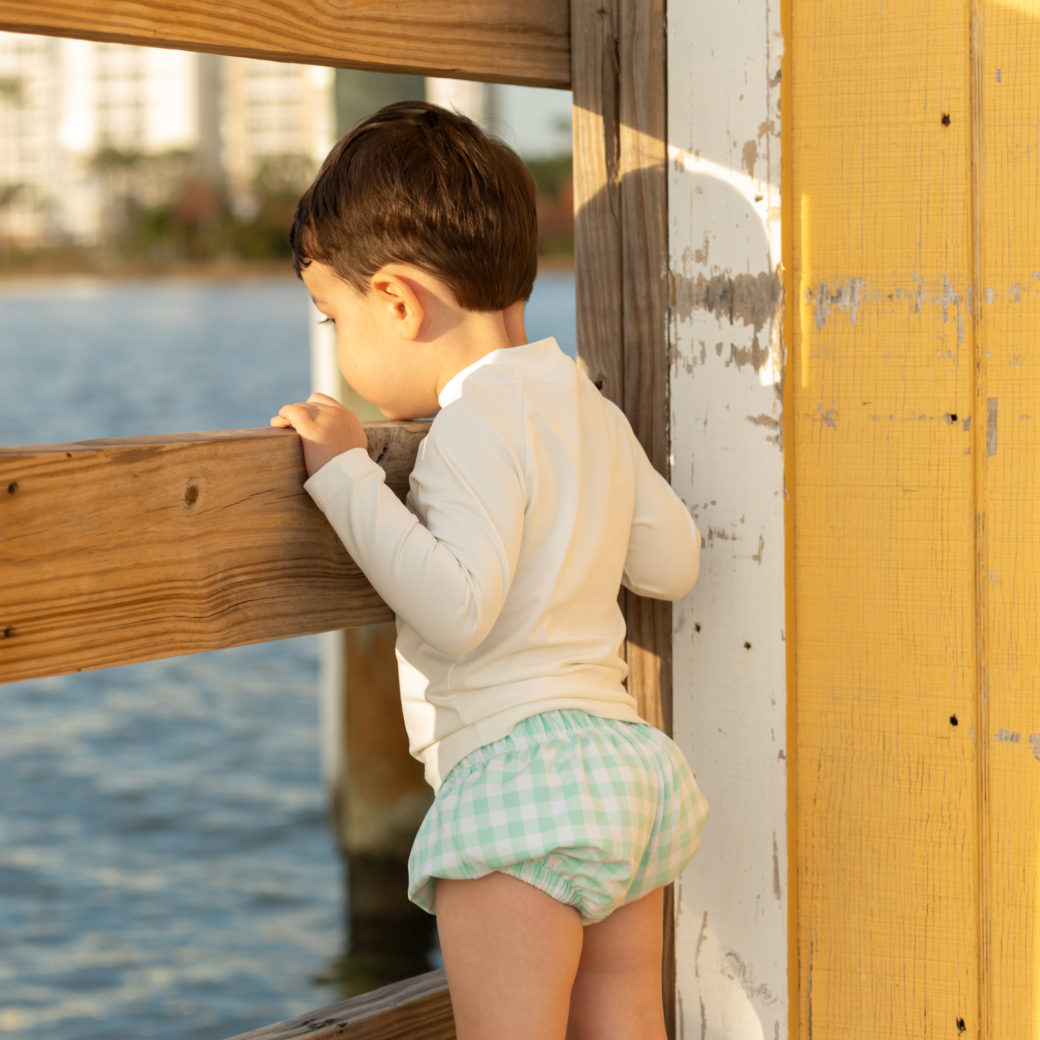 Baby boy swim bloomers in Seaside Seersucker with UPF 50+ protection; classic swim shorties with full coverage and elastic waist by Henry Duvall.