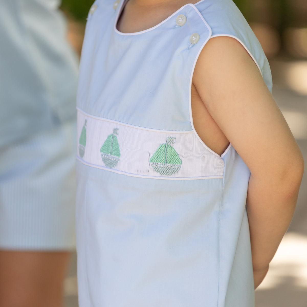 Henry Duvall Jennings Jon Jon in Bailey’s Bay Blue cotton with hand-smocked sailboats, classic heirloom baby boy summer outfit