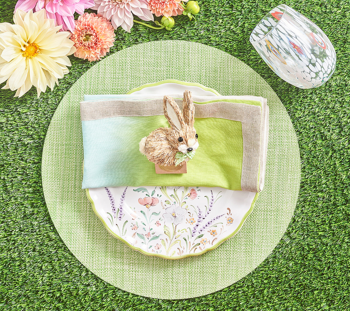Top view of Dip Dye Napkin in Blue & Green, Set of 4 showing green-to-light-blue ombré and metallic border on a spring table