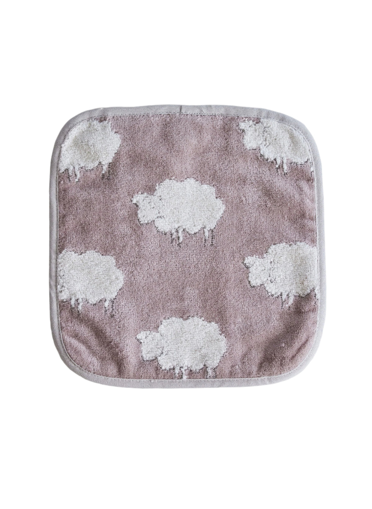 Top view of Sweet Sheep Jacquard Wash Cloth showcasing white sheep motifs and sand-colored binding with a white background