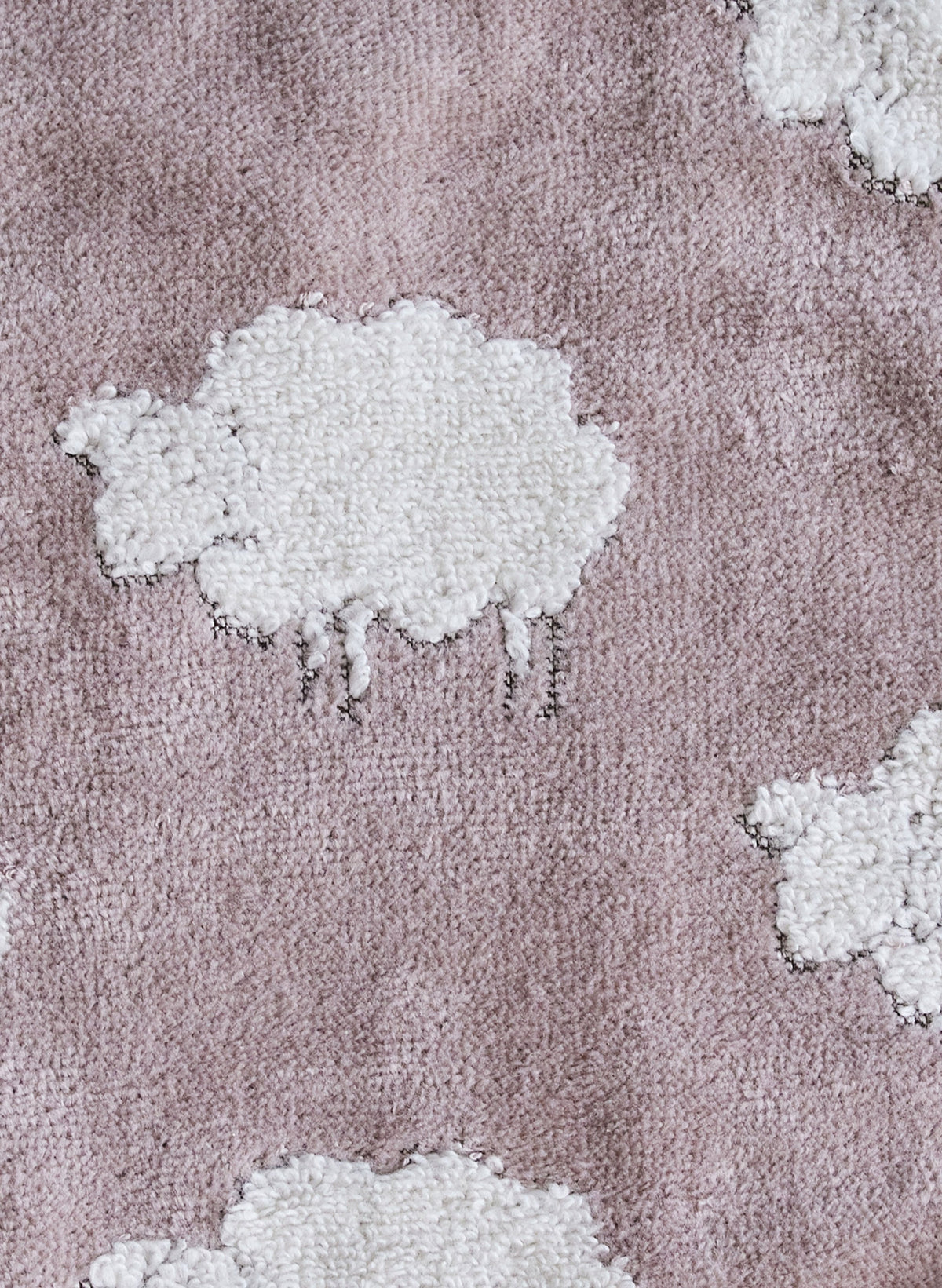 Close-up of Sweet Sheep Jacquard Wash Cloth showcasing white sheep motifs on textured mauve terry