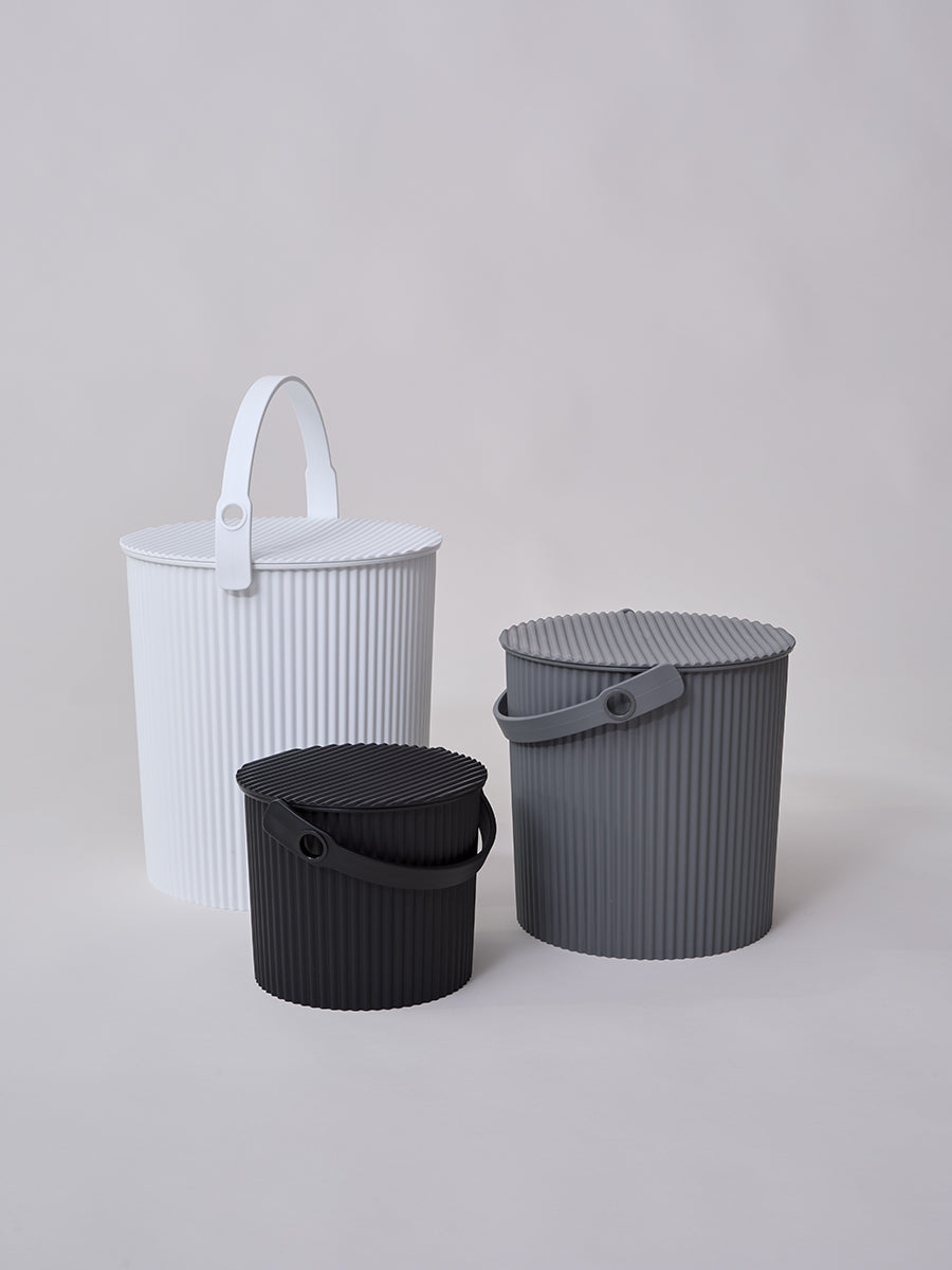 Front view of Hachiman extra large bucket in white showcasing ribbed texture, lid, and handle on light gray background