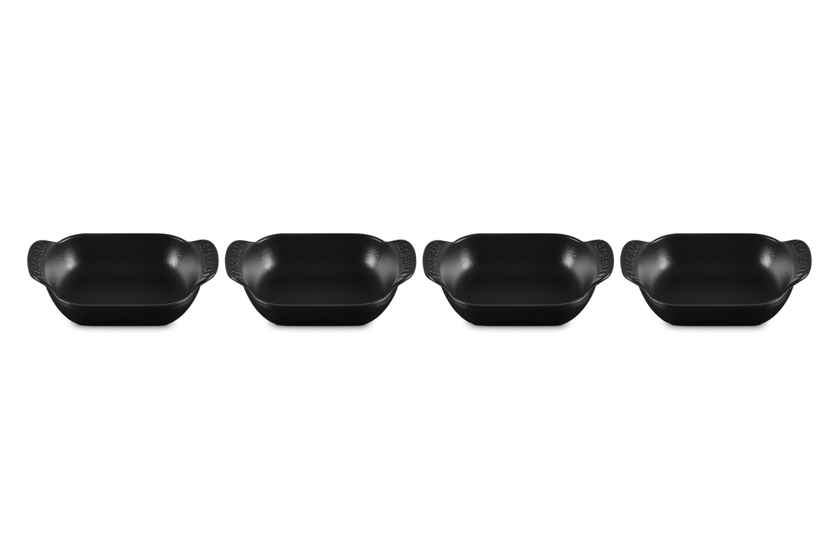 Top view of four Mini Rectangular Bakers, 1/3 qt each, in matte black with curved handles on white background
