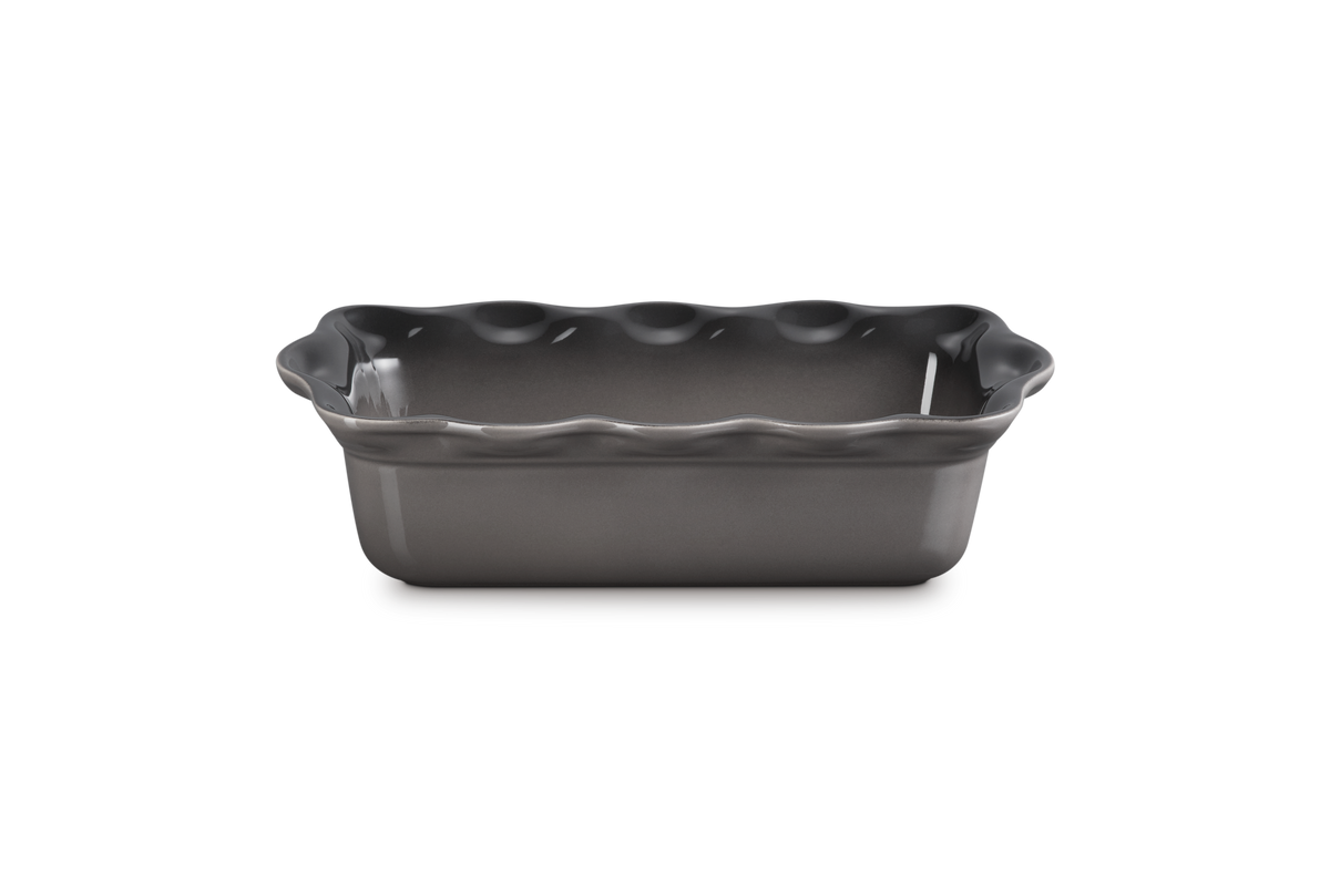 Three-quarter view of Heritage Fluted Loaf Pan in Oyster showcasing its deep fluted stoneware design on a white background