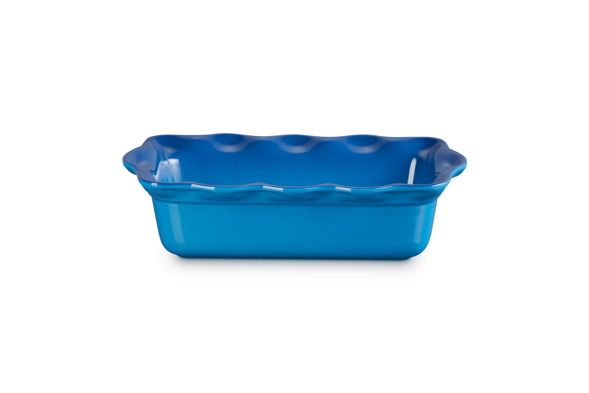 Angled view of Heritage Fluted Loaf Pan in Marseille showcasing its fluted interior and deep stoneware design on a white background