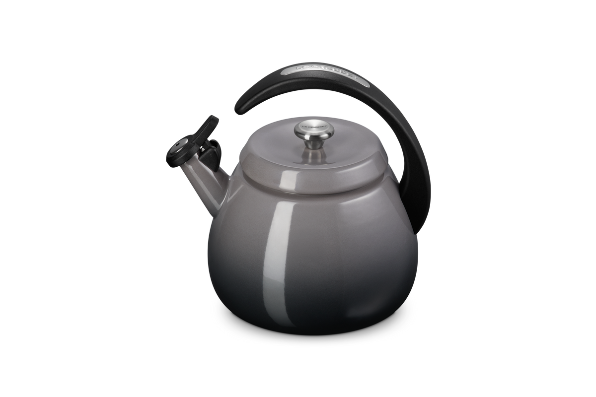 Three-quarter view of Cloche kettle in Oyster showcasing glossy enamel finish, halo-style handle and flip-up spout on white background