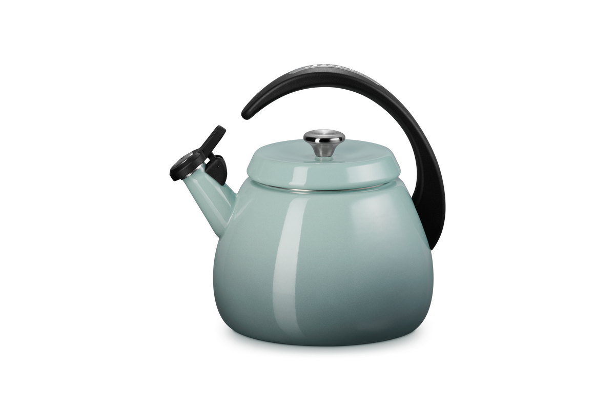 Close-up view of Cloche Kettle in Sea Salt showcasing glossy enamel finish and halo-style handle with a gray background