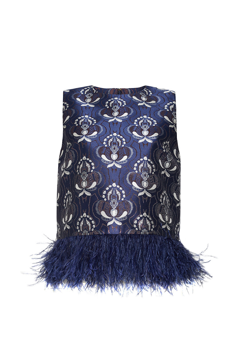 Front view of the Belmond Top in Vintage Deco Navy showcasing a blue floral pattern and feather-trimmed hem on a white background