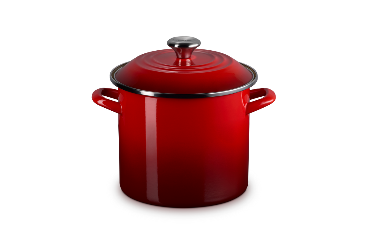 Three quarter view of 8 qt Stockpot in Cerise showcasing its matching lid and side handles against a gray background